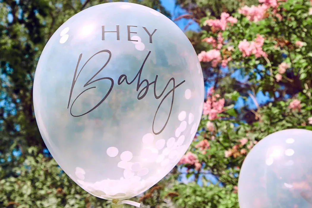 Baby shower balloon in a garden