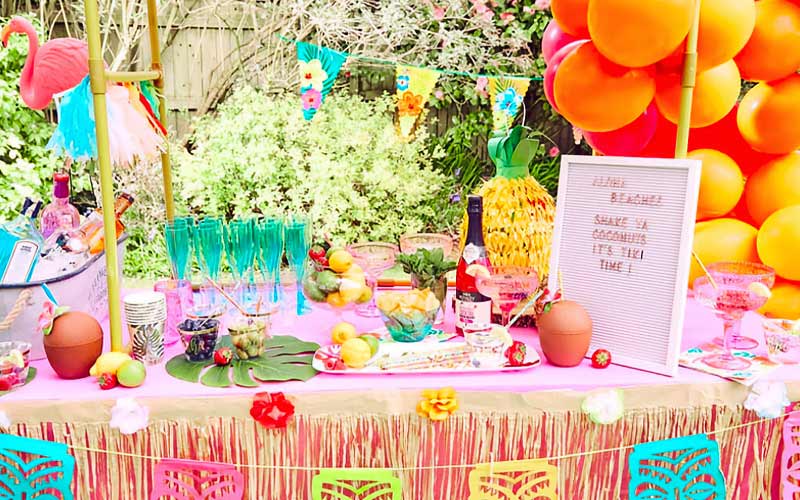 A beach party setup with Tiki Bar in the garden