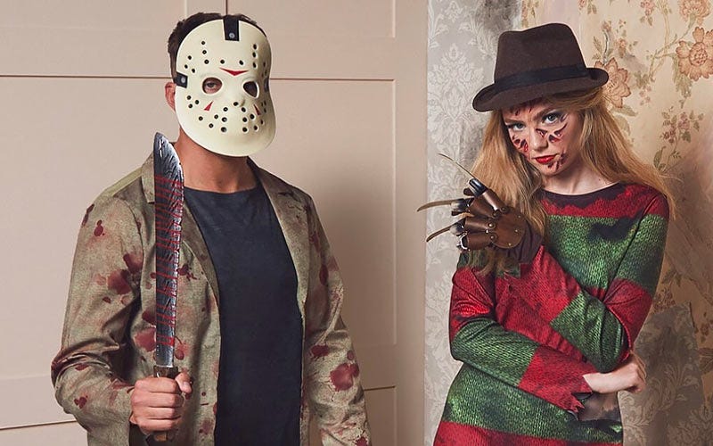 A man wearing a Jason Voorhees costume stands threatening next to a woman in a Freddy Krueger outfit